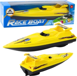 Gul motorbåd drevet af batteri