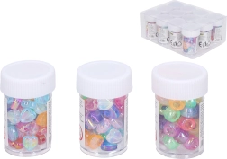 Farvede plastperler i rør