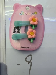 Hårklemme med orange blomst