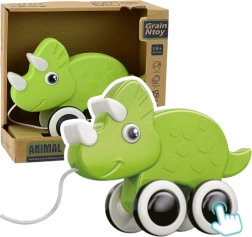 Grøn træksaurus med fløjte