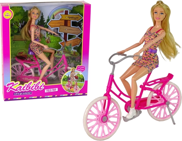 Dukke på lyserød cykel