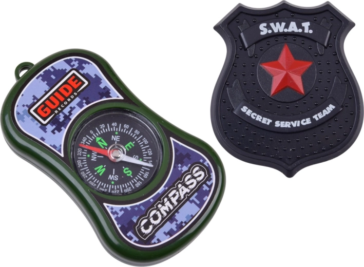 Kikkert, kompas og badge til actionmissioner