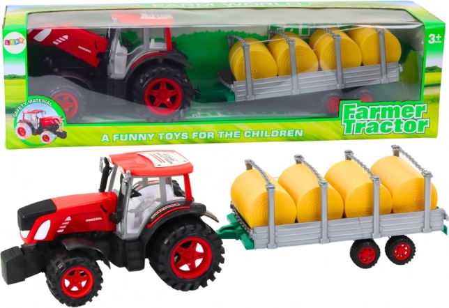 Stor traktor med trailer og høballer