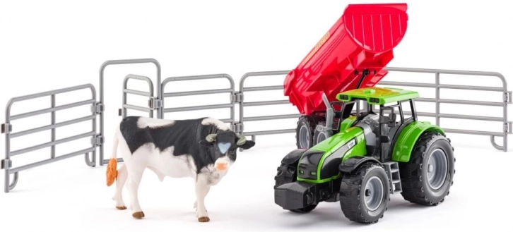 Traktor med påhængsvogn, tyr og indhegning til børn