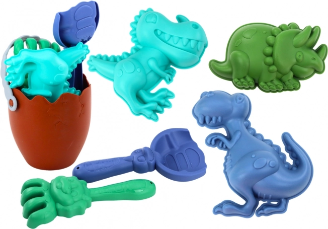 Sandsæt dinosaurer med æggeformet spand, skovl, rive og forme