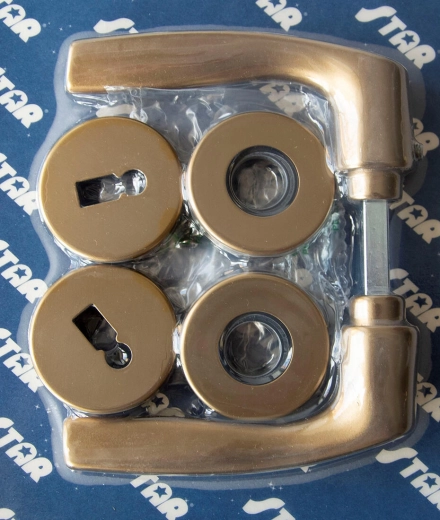 Dørgreb MONET med roset F4, nøgle, bronzefarvet eloxal