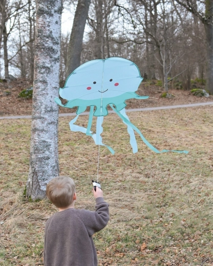 Muntert blækspruttedesign med flagrende bånd