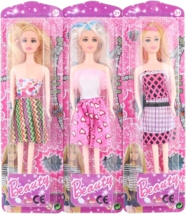 Dukke i farverig kjole 28 cm