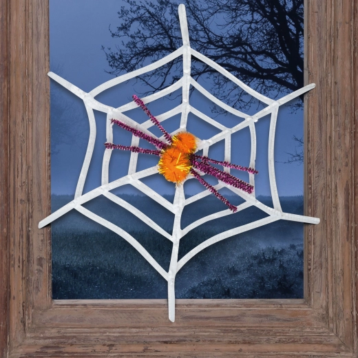 Hvidt halloween-spindelvæv med gul edderkop