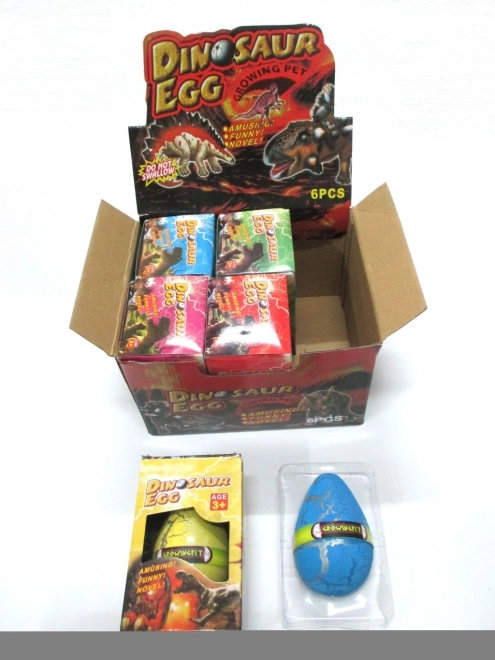 Æg med voksende dinosaur 12 × 8 cm