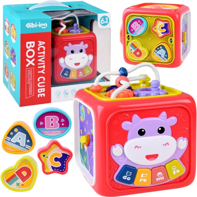 Interaktiv terning til læring med klaver, labyrint og sorteringsboks