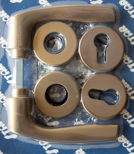 Dørgreb MONET på roset, cylindrisk cylinder, bronzeeloxeret