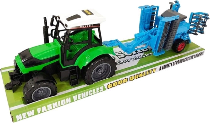 Børnetraktor med tilkoblet landbrugsredskab