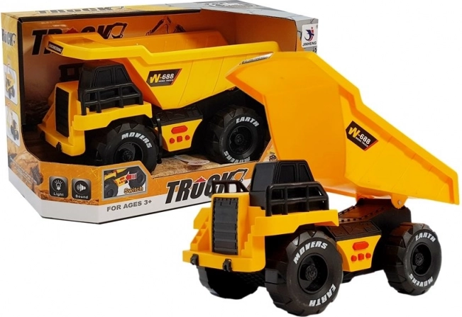 Gul legetøjs-lastbil med tip, friktionsdrev, lys og lyde