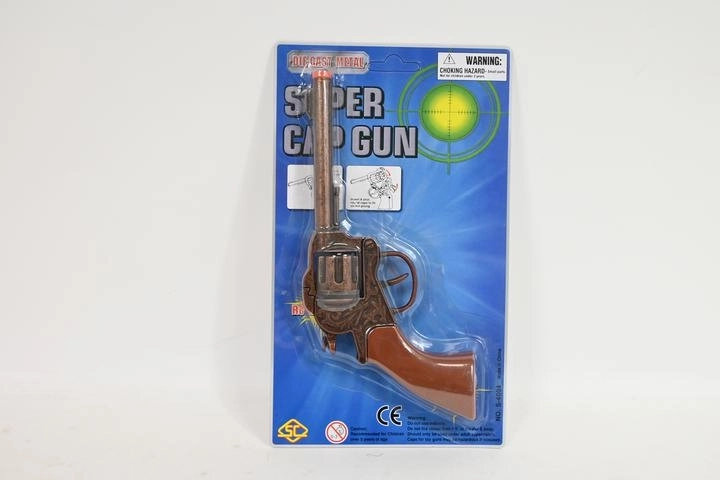 Metalkapselpistol i blisterpakning