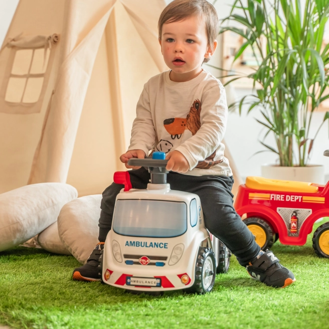FALK Løbecykel Ambulance med åbent sæde og horn på rattet