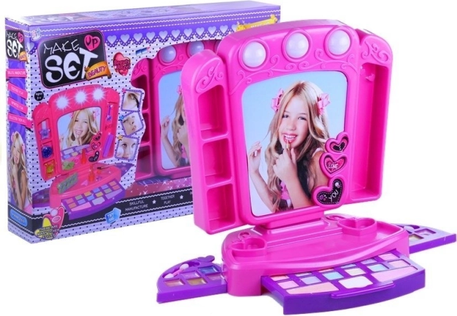 Rosa børne-toiletbord med makeup og lys