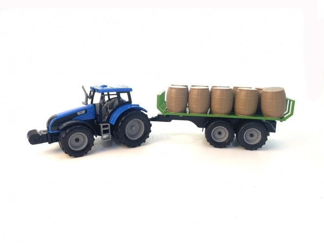 Traktor med svinghjul og trailer fyldt med hø