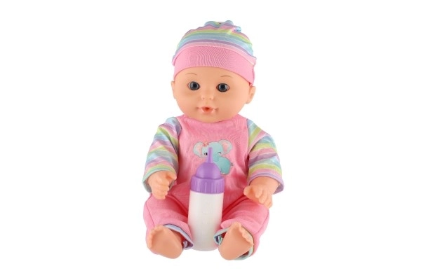 Dukke baby 30cm plast i bæreslynge/autostol med flaske i blister