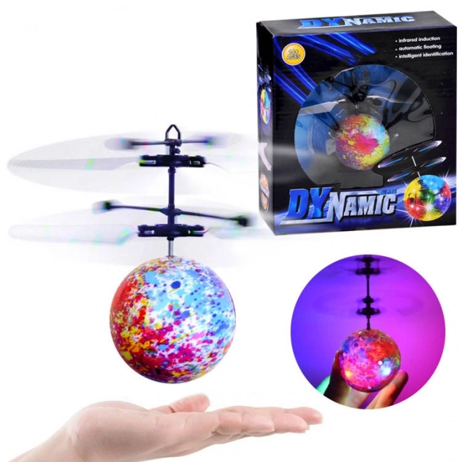 Flyvende lysende Disco bold styret med hånden