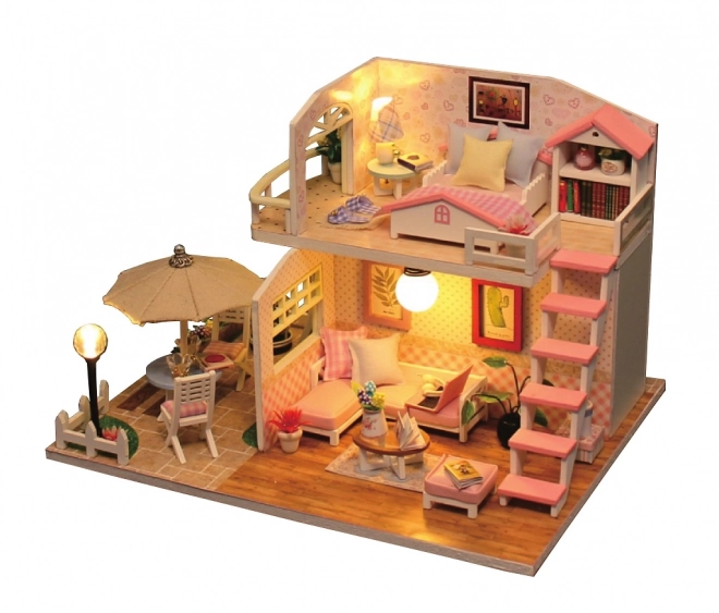 Ni små miniature huse Lyserødt hus