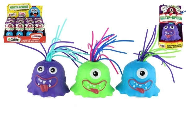 Monster med sugekop plastik 7cm på batteri med lyd, lys 3 farver i kassen 12 stk i æske