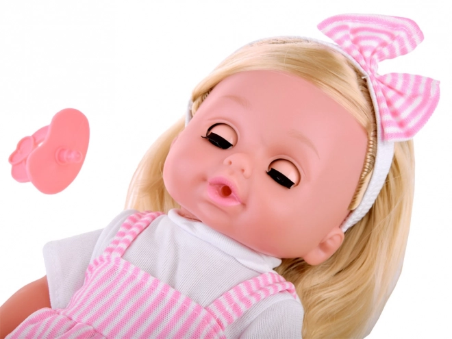 Babydukke med langt hår, taler og græder
