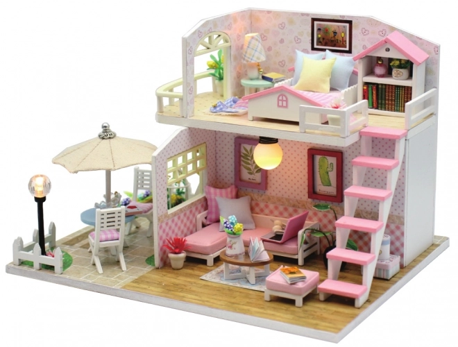 Ni små miniature huse Lyserødt hus
