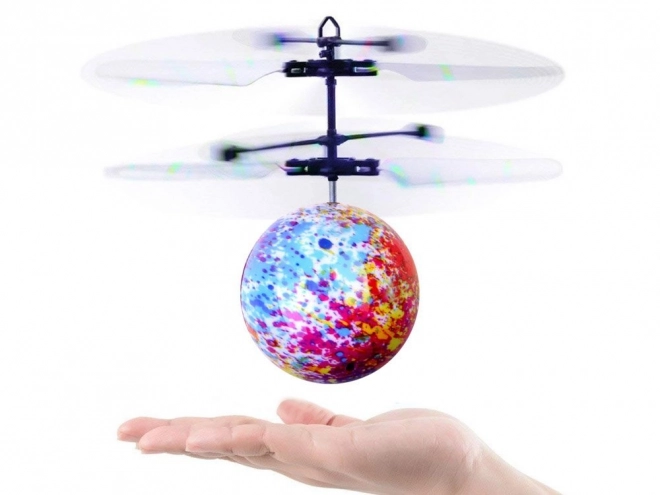 Flyvende lysende Disco bold styret med hånden