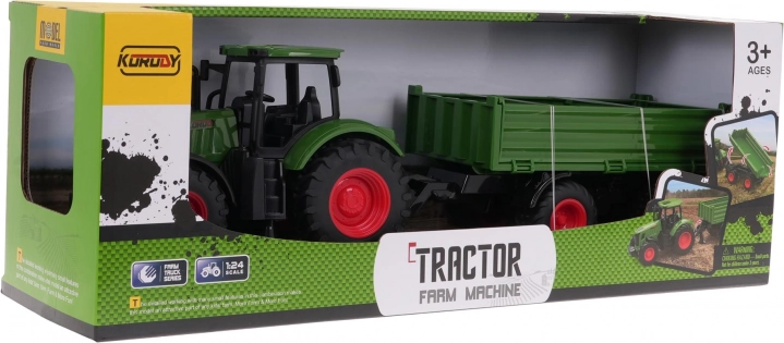 Grøn traktor med trailer