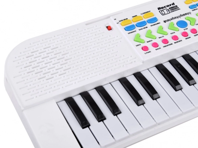Elektronisk børnekeyboard med mikrofon