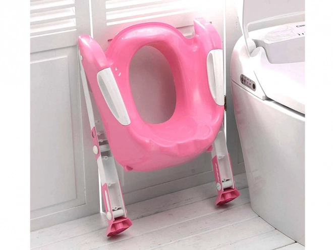 Lyserød toilettaburet til børn