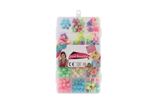 Plastperler farverige med snor i plastboks 10x17x2cm