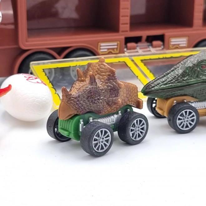 Dinosaur-lastbil med affyrer og små biler