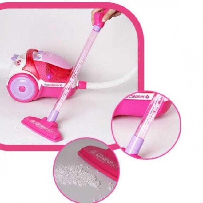 Børnestøvsuger i pink med sugefunktion