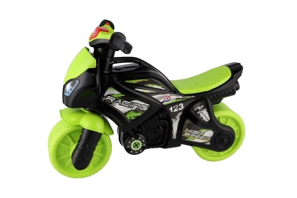 Løbecykel motorcykel grøn-sort plast på batterier med lys og lyd i pose 36x53x74cm