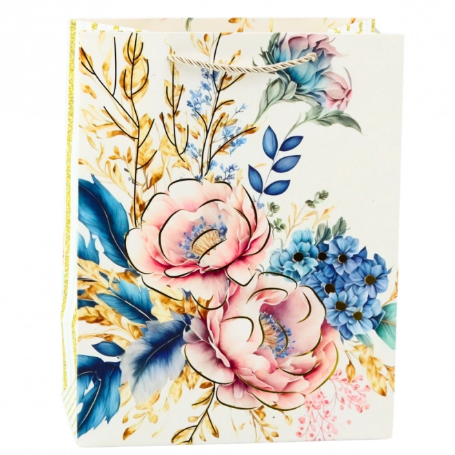 Gavepose med blomster og gyldne elementer