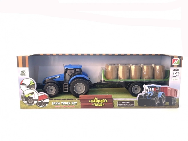 Traktor med svinghjul og trailer fyldt med hø