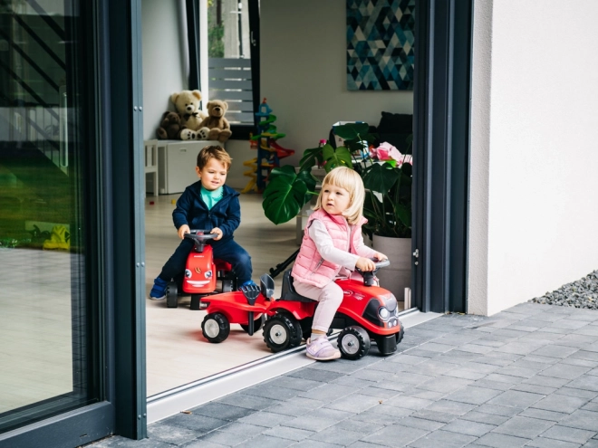 Kørende traktor Baby Case IH rød med trailer