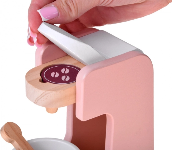 Kapselkaffemaskine med kop og ske