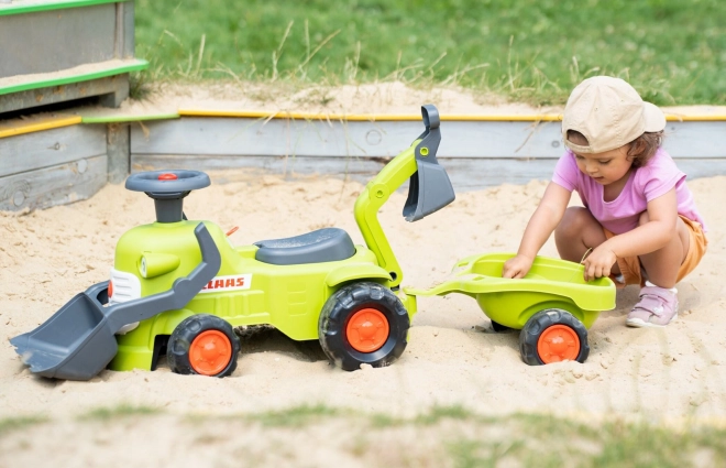 Kørende traktor Claas med trailer, læsser og skovl