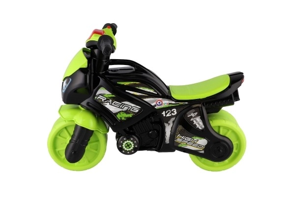 Løbecykel motorcykel grøn-sort plast på batterier med lys og lyd i pose 36x53x74cm