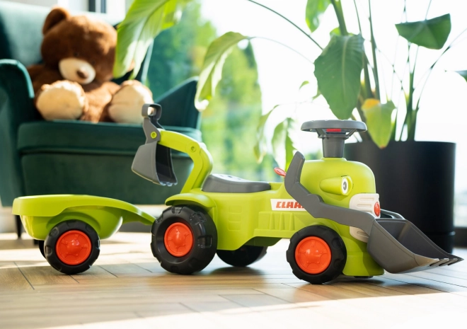 Kørende traktor Claas med trailer, læsser og skovl