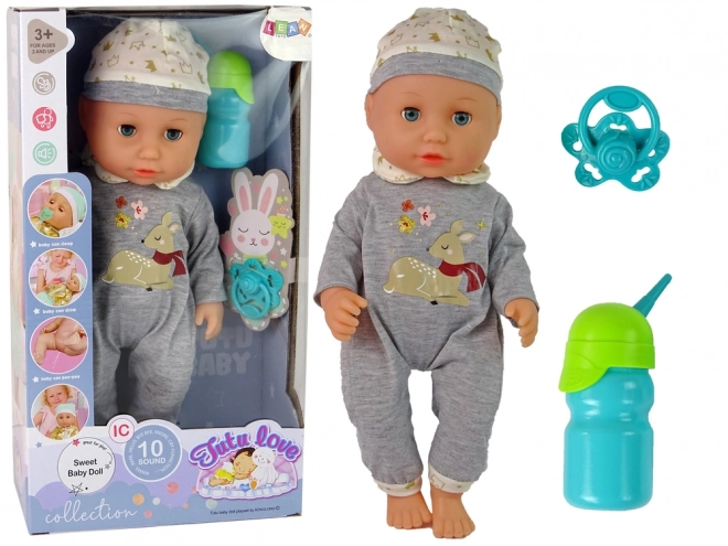 Babydukke i gråt pytjamas med lyde og tilbehør
