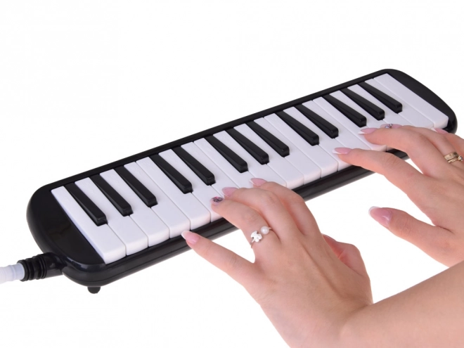 Melodika med klaviatur og etui