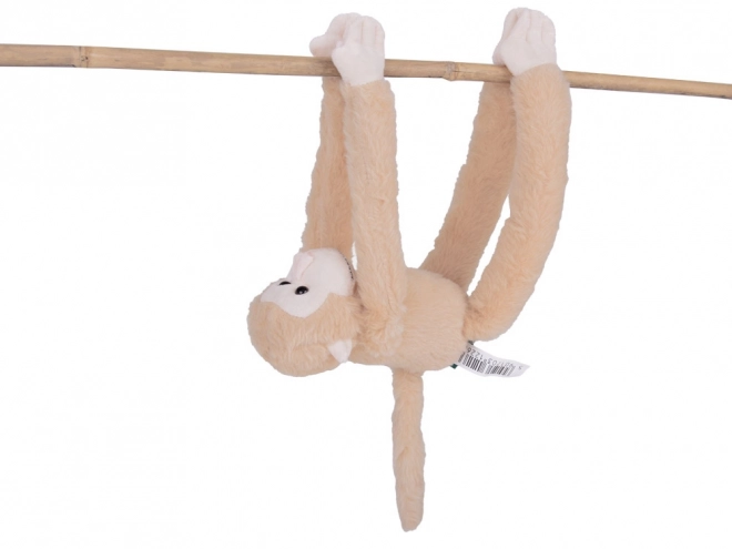Hængende abe maskot i beige farve