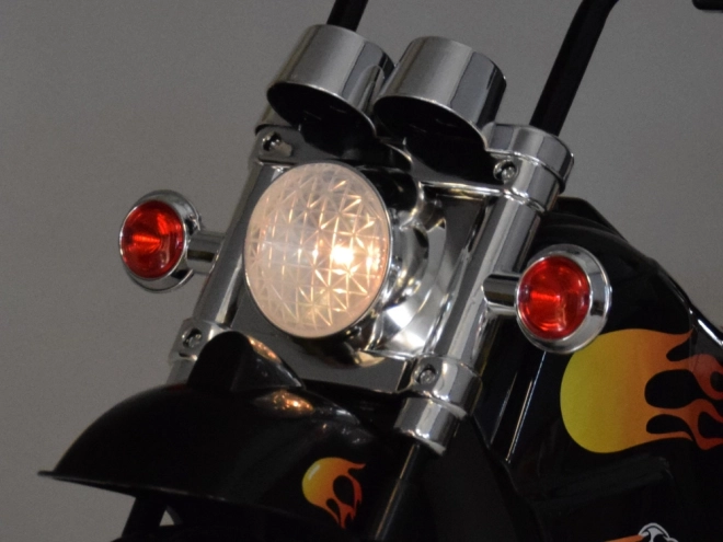 Børnemotorcykel på batteri med effekter