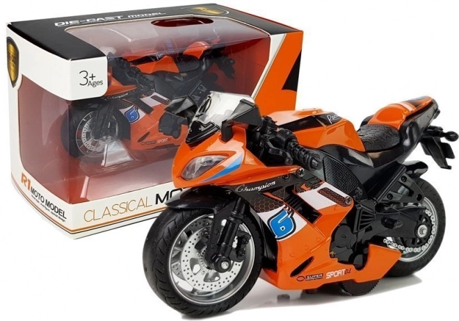 Orange legetøjsmotorcykel med fremdrift