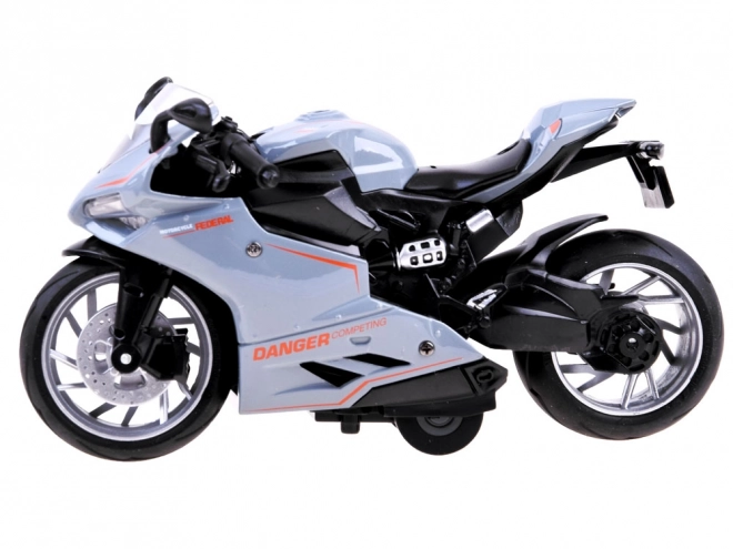 Metalmodel af motorcykel med trækfjeder – A
