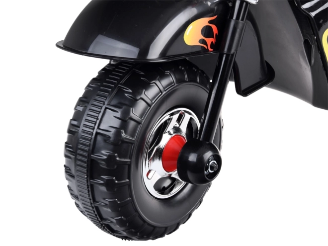 Børnemotorcykel på batteri med effekter